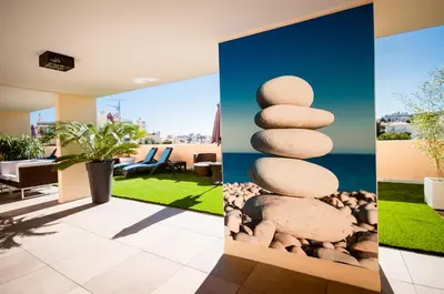 a group of three pictures of a living room with rocks at Residhome Nice Promenade in Nice