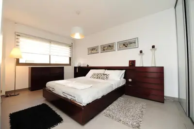 a bedroom with a large bed and a window at Nice Étoile Grand Suite Five stars Holiday House in Nice