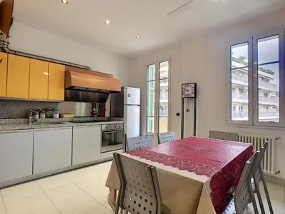 a kitchen with a table with a red table cloth on it at Nestor&Jeeves - PALAIS NICOLE - Central - Very close sea in Nice