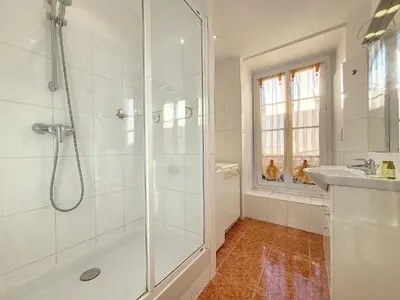 a white bathroom with a shower and a sink at Nestor&Jeeves - MEYERBEER - Central - Very close sea in Nice
