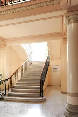a staircase in a building with a stair case at Appartement Clemenceau Centre Nice Five stars Holiday House in Nice