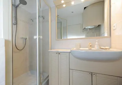 a bathroom with a sink and a shower at Appartement Clemenceau Centre Nice Five stars Holiday House in Nice
