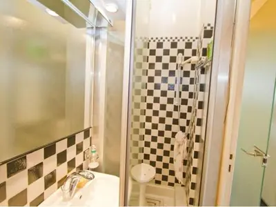 a bathroom with a shower and a sink and a toilet at LE MIRAGE, SEA FRONT view, 3 bedrooms, 100m in Nice