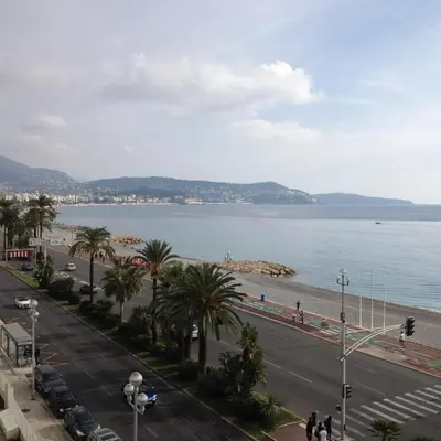 a view of the beach and ocean from a building at LE MIRAGE, SEA FRONT view, 3 bedrooms, 100m in Nice