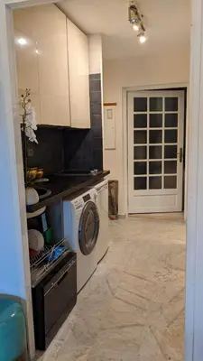 a kitchen with a washing machine and a washer at Saint Jean Cap Ferrat in Saint-Jean-Cap-Ferrat