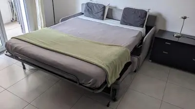 a bed in a room with at Appartement Fodéré 2 in Nice