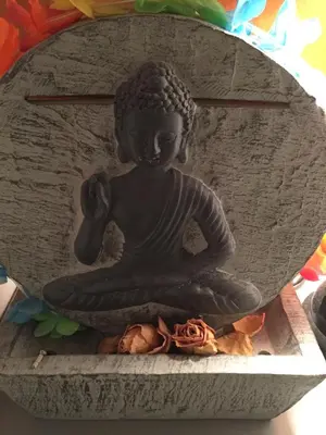 a statue of a woman sitting in a meditation pose at Chambre calme centre Nice labellisée in Nice