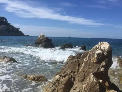 a view of the ocean with rocks in the water at Chambre calme centre Nice labellisée in Nice