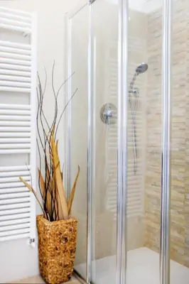 a bathroom with a shower and a vase with a plant at MY CASA - PROM 13 - Sea View - Promenade des Anglais - Terrace in Nice
