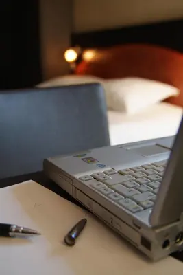 a laptop computer sitting on top of a table at Hôtel Du Baou in La Gaude