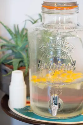a glass jar filled with water on a shelf at Hôtel Relais Acropolis in Nice