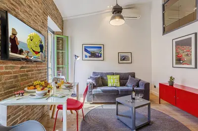 a living room with a table and a couch at MY CASA - 4 PLACE MASSENA - DUPLEX in Nice