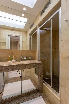 a bedroom with a bed and a balcony with a table at ROYAL PROMENADE Pool Terrace Sea View Air Conditioning in Nice