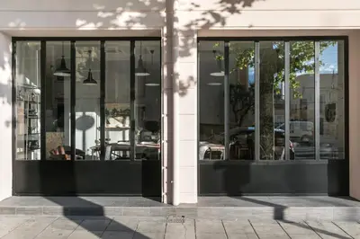 a store front with glass doors on a building at Hotel So’Co by Happyculture in Nice