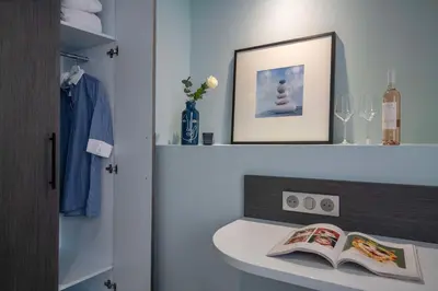 a bathroom with a sink with a book on it at Best Western Alba in Nice