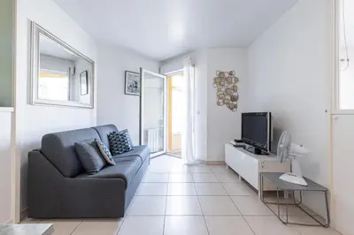 a living room with a couch and a tv at Quiet 1 bdr Port! close Place du Pin Garibaldi in Nice
