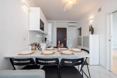 a kitchen and dining room with a table and chairs at Sea view - 2 Bdr Promenade des Anglais in Nice