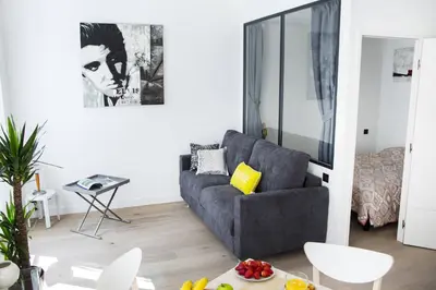 a living room with a couch and a table at MY CASA - 48 GIOFFREDO - NEAR PLACE MASSENA in Nice