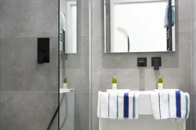 a bathroom with two sinks and a mirror at MY CASA - 48 GIOFFREDO - NEAR PLACE MASSENA in Nice