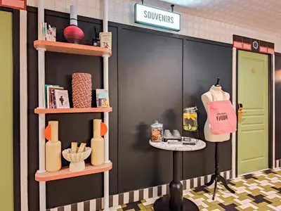 a store front with shelves of products on the wall at Hotel Aparthotel AMMI Nice Lafayette in Nice
