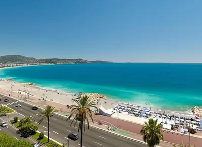 a view of a beach and the ocean at Beachfront apartment Promenade Des Anglais in Nice