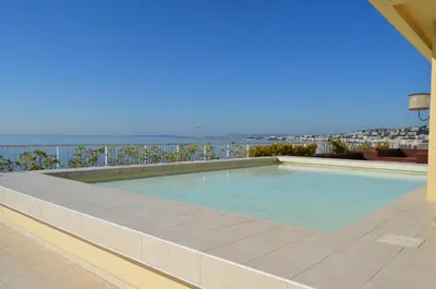 a swimming pool on the roof of a building at Royal Lux NICE -Last floor, see view in Nice