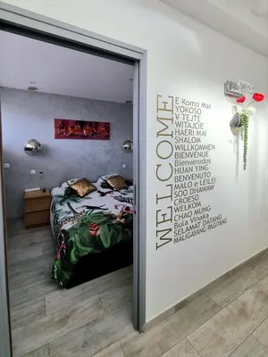 a bedroom with a bed and a wall with words on it at Royal Lux NICE -Last floor, see view in Nice