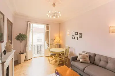 a living room with a couch and a table at Appartement carre d'or in Nice