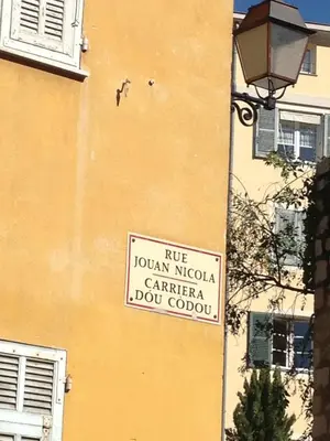 a sign on the side of a building at Rue Neuve - Old Town Apartment in Nice