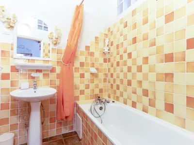 a bathroom with a tub and a sink and a bath tub at Apartment Miralheti by Interhome in Nice