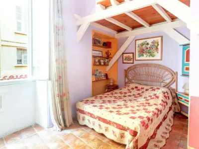 a bedroom with a bed and a window at Apartment Miralheti by Interhome in Nice
