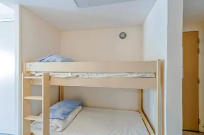 a bunk bed in a small room with a bunk bed at Residence Heliotel Marine - maeva Home in Saint-Laurent-du-Var