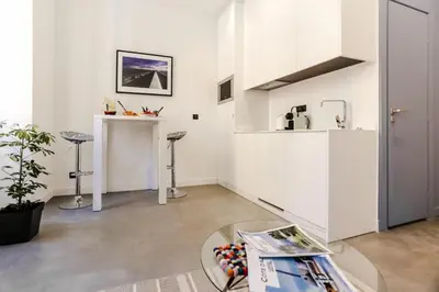 a living room with a table and a counter at MY CASA - PAULE - Great Old Town Studio w AC in Nice