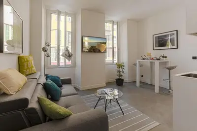 a living room with a couch and a table at MY CASA - PAULE - Great Old Town Studio w AC in Nice