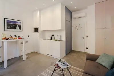a living room with a couch and a table at MY CASA - PAULE - Great Old Town Studio w AC in Nice