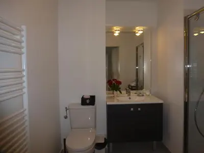 a bathroom with a toilet and a sink at beau studio in Nice