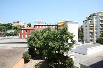 a tree on the roof of a building at Le Renoir in Nice