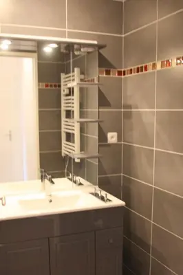 a bathroom with a sink and a mirror at Le Renoir in Nice