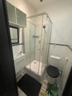 a bathroom with a glass shower and a toilet at iNICE in Nice