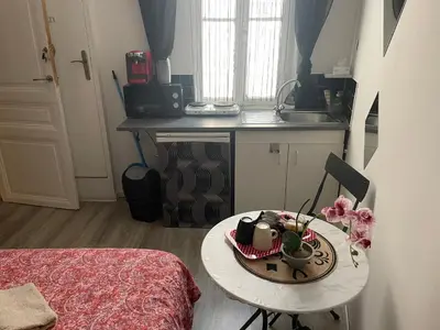a small kitchen with a table in a room at iNICE in Nice