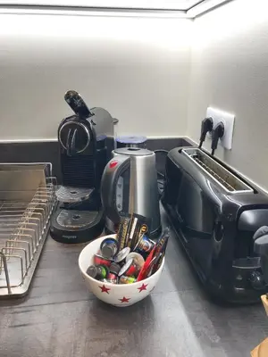 a kitchen counter with a bowl of kitchen utensils at Dreamplace in Nice
