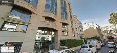 a tall building with cars parked in front of it at Superbe Studio in Nice at 450m from the sea with Clim in Nice