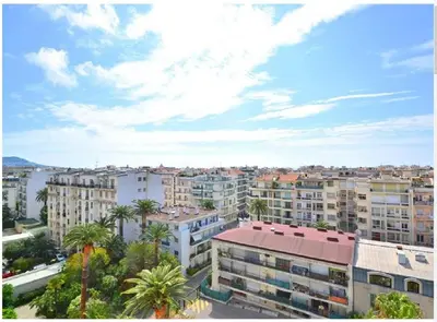 a view of a city with palm trees and buildings at Luxurious Studio in NICE 450 m of the sea in Nice