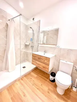 a bathroom with a shower toilet and a sink at Promenade des Anglais panoramic sea view in Nice