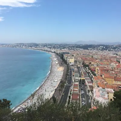 a view of a beach with a city and the ocean at Parc Anahit in Nice