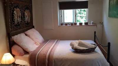 a bedroom with a bed with a basket on it at Lovely house in Cagnes-sur-Mer