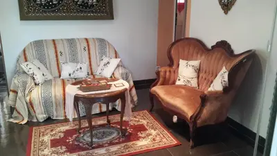 a living room with a couch and a chair at Lovely house in Cagnes-sur-Mer