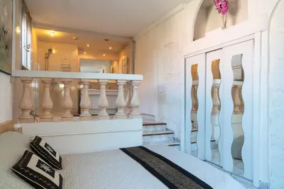 a staircase in a house with a mirror at Apartment Villa Anahit in Nice