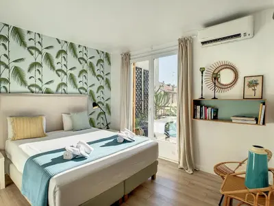 a bedroom with a bed and a large window at Nestor&Jeeves - SUNNY TERRACE - Central - Very close sea - Top Floor in Nice