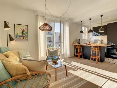 a living room with a couch and a kitchen at Nestor&Jeeves - SUNNY TERRACE - Central - Very close sea - Top Floor in Nice